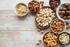 Bowls with various  nuts on a table